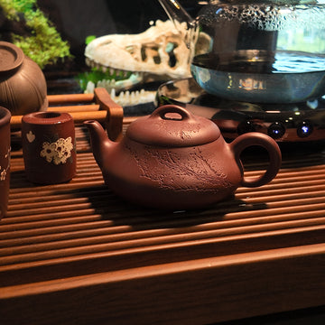 Terasilk Handmade Yixing Teapot | Engraved Plum Blossom "Shi Piao" Tripod | Premium Zi Ni Clay-120ml